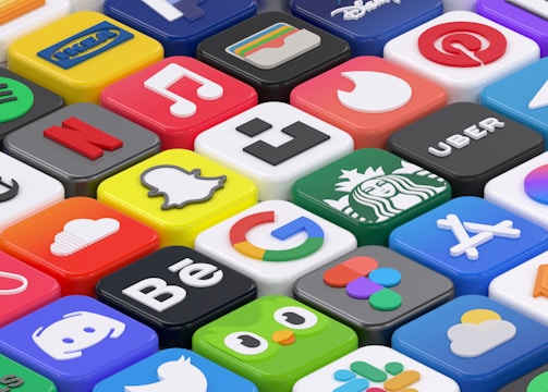 A collection of colorful 3D app icons arranged in a grid-like pattern, featuring well-known brands and services such as Spotify, Netflix, Discord, and Facebook. Each icon is distinct with vibrant colors and recognizable logos, giving a sense of modern digital culture.
